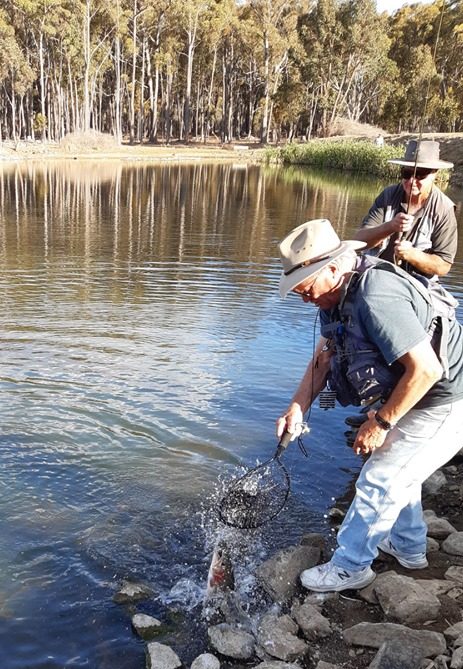 Iain netting a fish
