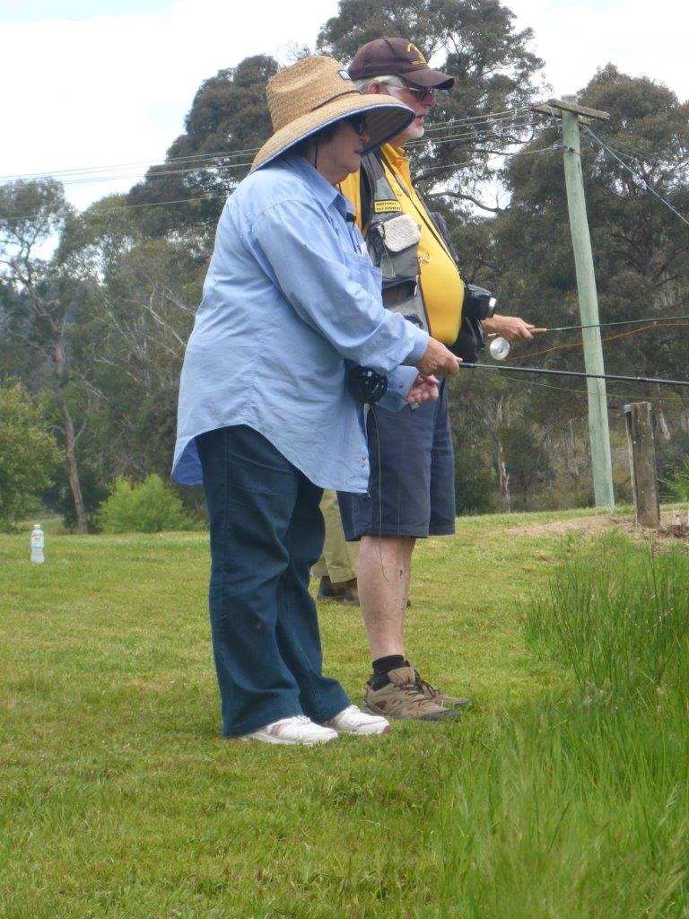 Casting for Recovery participant Dianne waiting for another strike