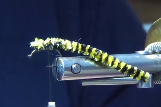 Wind the lead free wire onto the hook and cover with thread. Then tie the variegated extended body on top of the hook.