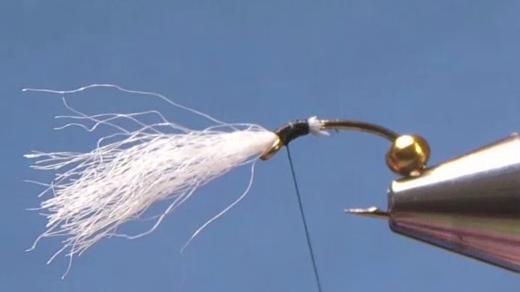 Thread started and white poly yarn tied in as gills, trimmed at an angle to form a ramp.