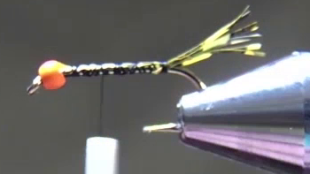 Twelve strands of micro olive Voodoo Fibres tied in at the hook bend, forming a short, sparse tail.