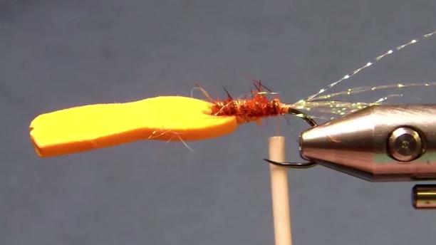 Hook with dubbed underbody and foam strip pierced through the eye and tied in underneath.
