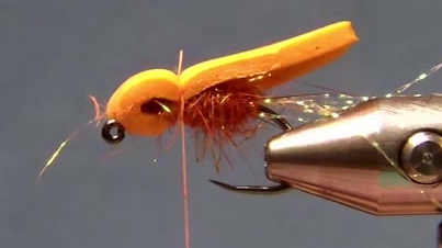 Foam folded forward and tied down to form the head; flash trimmed slightly past foam end.