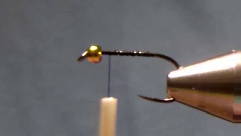 Hook threaded with base layer of tying thread, ready for tail attachment.