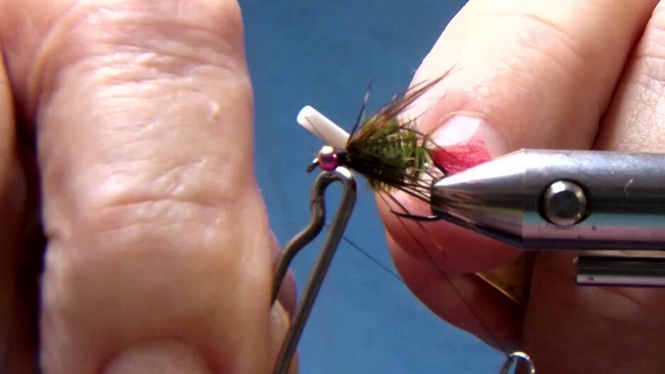 Thread tied off and whip finish completed, securing Malleefowl hackle.