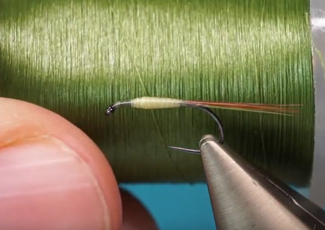 Slender tapered body formed with thread, whip finished.