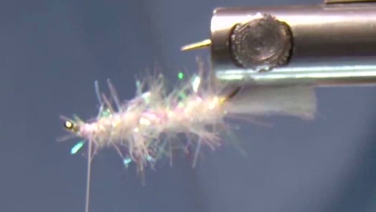 Tail material tied in at hook bend and chenille secured and wrapped forward along the shank, ending just behind the hook eye.